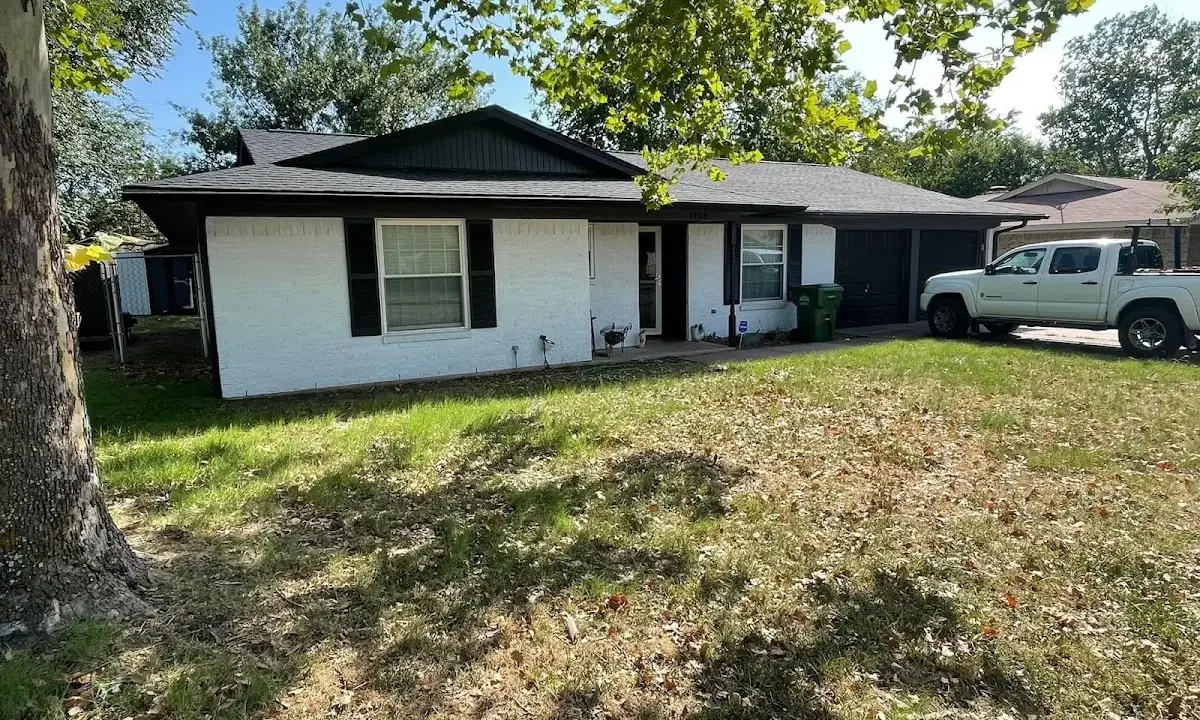 Professional roofing crew working on a residential roof in Frankenmuth